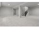 Spacious basement with carpet and stairs leading to the upper level at 21204 E 63Rd Dr, Aurora, CO 80019