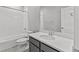 Fresh bathroom featuring a shower-tub combo, stylish vanity, and elegant tile flooring for a clean, modern look at 21204 E 63Rd Dr, Aurora, CO 80019