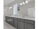 Bathroom features double vanity sinks, quartz countertop, and large shower at 21204 E 63Rd Dr, Aurora, CO 80019