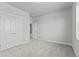 Large carpeted bedroom with large closet with double doors and natural light at 21204 E 63Rd Dr, Aurora, CO 80019