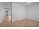 Versatile empty room with sleek wood floors, ready to be personalized into your dream space at 21204 E 63Rd Dr, Aurora, CO 80019