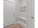 A useful mudroom is located off the main entryway with a bench and hooks at 21204 E 63Rd Dr, Aurora, CO 80019