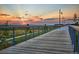 Scenic walking path with beautiful sunset views, enhancing the community's appeal and outdoor lifestyle at 21204 E 63Rd Dr, Aurora, CO 80019