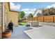Outdoor living space featuring a hot tub, gas grill, and privacy fence at 19677 E Vassar Dr, Aurora, CO 80013