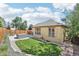 The home's backyard includes a hot tub, patio, green space, and tasteful landscaping at 19677 E Vassar Dr, Aurora, CO 80013