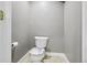 Bathroom with a modern toilet featuring a decorative seat and neutral wall color at 19677 E Vassar Dr, Aurora, CO 80013