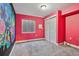 Bright bedroom with unique wall art, a window, and spacious closet at 19677 E Vassar Dr, Aurora, CO 80013