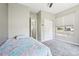 Bedroom features a bed, closet with mirrored doors, and natural light from the window at 19677 E Vassar Dr, Aurora, CO 80013