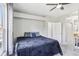 Spacious bedroom featuring ample natural light, soft carpet, and a comfortable bed at 19677 E Vassar Dr, Aurora, CO 80013