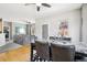 A modern table set is situated in this open dining and living space at 19677 E Vassar Dr, Aurora, CO 80013