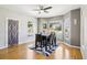 Sunlit dining area with a stylish area rug, set within a bright and airy space at 19677 E Vassar Dr, Aurora, CO 80013