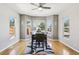 Bright dining room with bay windows and a modern table set, perfect for entertaining at 19677 E Vassar Dr, Aurora, CO 80013