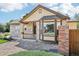 Inviting single-Gathering home with a stone facade, bay window, and a cozy front porch at 19677 E Vassar Dr, Aurora, CO 80013