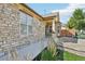 Beautiful home with stone exterior, complemented by well-kept landscaping and a welcoming walkway at 19677 E Vassar Dr, Aurora, CO 80013