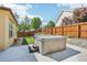Backyard featuring a relaxing hot tub, perfect for unwinding after a long day at 19677 E Vassar Dr, Aurora, CO 80013
