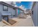 Back of the house with a blue door and stairs at 597 Vista Dr, Castle Rock, CO 80104