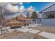 Backyard with a fire pit and modern patio pavers, mountain in the background at 597 Vista Dr, Castle Rock, CO 80104