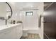 Stylish bathroom with white subway tile, patterned floor, and a modern vanity at 597 Vista Dr, Castle Rock, CO 80104