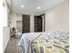 Relaxing bedroom with closet and patterned bedding, carpeted floors at 597 Vista Dr, Castle Rock, CO 80104