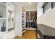 Spacious walk-in closet with custom shelving, modern drawers, and a view into the bathroom at 597 Vista Dr, Castle Rock, CO 80104