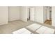 Neutral bedroom with carpeted floors and open doorway at 6581 N Malaya St, Aurora, CO 80019