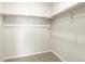 Empty walk-in closet with shelving and carpet at 6581 N Malaya St, Aurora, CO 80019