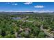 Picturesque aerial scene of a lakeside community with mountains in the horizon on a sunny day at 12135 W Applewood Knolls Dr, Lakewood, CO 80215