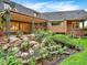 Backyard landscaping with rock features and covered patio, perfect for outdoor living at 12135 W Applewood Knolls Dr, Lakewood, CO 80215