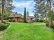 Expansive backyard with mature trees, offering privacy and a picturesque setting at 12135 W Applewood Knolls Dr, Lakewood, CO 80215