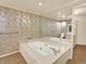 Relaxing bathroom with a deep soaking tub and large mirror, perfect for unwinding at 12135 W Applewood Knolls Dr, Lakewood, CO 80215