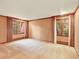 Spacious living room with two large windows dressed with full-length draperies at 12135 W Applewood Knolls Dr, Lakewood, CO 80215