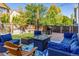 Relaxing backyard deck with seating area, fire pit, and string lights at 5630 Spruce Ave, Castle Rock, CO 80104