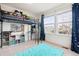 bedroom with a loft bed and built-in storage at 5630 Spruce Ave, Castle Rock, CO 80104