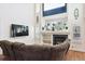 Spacious living room featuring a fireplace and large window at 5630 Spruce Ave, Castle Rock, CO 80104