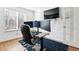 Home office with built-in desk and multiple monitors at 5630 Spruce Ave, Castle Rock, CO 80104