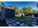 Gray storage shed with paved pathway at 5630 Spruce Ave, Castle Rock, CO 80104