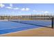 Community tennis courts with blue surface at 5630 Spruce Ave, Castle Rock, CO 80104