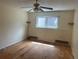 Bedroom features a ceiling fan and a window that allows natural light to illuminate the space at 14602 E 2Nd Ave # 108-C, Aurora, CO 80011
