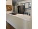 Kitchen features a double sink and stainless steel fridge at 14602 E 2Nd Ave # 108-C, Aurora, CO 80011