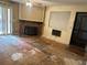 Living room features a red brick fireplace and a ceiling fan at 14602 E 2Nd Ave # 108-C, Aurora, CO 80011