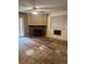 Living room features a red brick fireplace and a ceiling fan at 14602 E 2Nd Ave # 108-C, Aurora, CO 80011