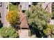 Birds eye view of a well maintained house with a lovely roof and mature trees with beautiful fall colors at 1755 Quince St, Denver, CO 80220