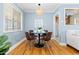 Charming dining space with modern table set, a hanging light and bright natural light at 1755 Quince St, Denver, CO 80220
