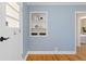 Hallway with a built in bookshelf and view of the bedroom at 1755 Quince St, Denver, CO 80220