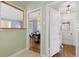 Charming hallway featuring views into the dining room and another room, showcasing the home's layout at 1755 Quince St, Denver, CO 80220
