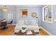 Comfortable living room with modern decor, wooden floors, and an open view to the kitchen at 1755 Quince St, Denver, CO 80220