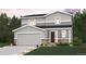 Charming two-story home featuring stone accents, a gray color palette, and a well-manicured lawn at 4315 Gozzer Ranch Dr, Elizabeth, CO 80107