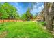 Picturesque backyard with lush greenery, mature trees, a playground, and covered patio providing a perfect outdoor retreat at 4012 S Newport Way, Denver, CO 80237