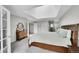 Bright bedroom featuring a skylight, carpeted floors, and neutral decor at 4012 S Newport Way, Denver, CO 80237