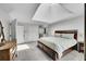 Spacious bedroom features a large bed, skylight, and adjoining bathroom at 4012 S Newport Way, Denver, CO 80237